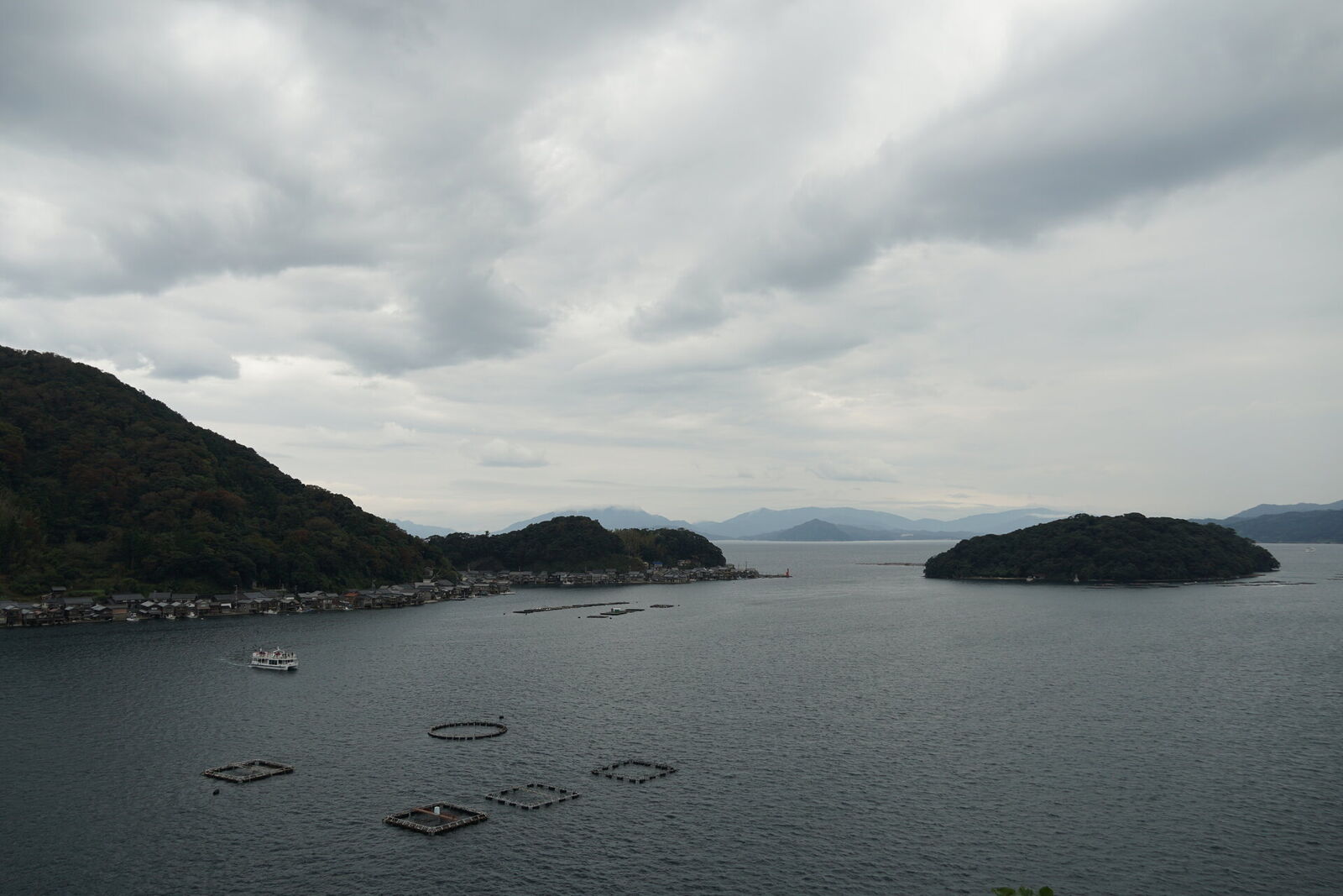 Ine Bay panorama with aquaculture rings, green islands, and mountain ridges on the Sea of Japan