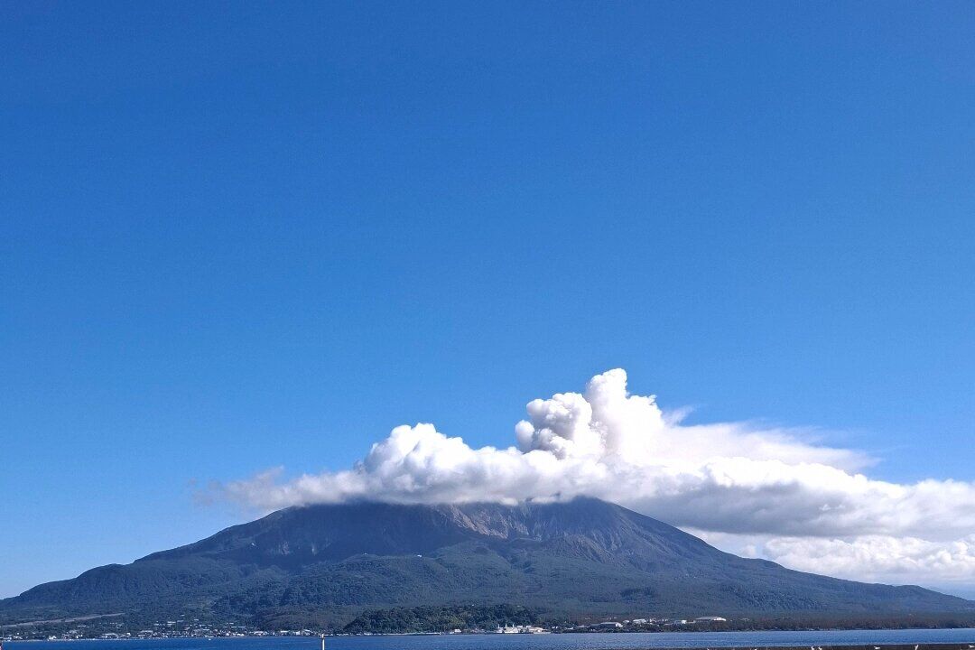 Sakurajima volcano with dramatic volcanic clouds seen from the Kagoshima ferry