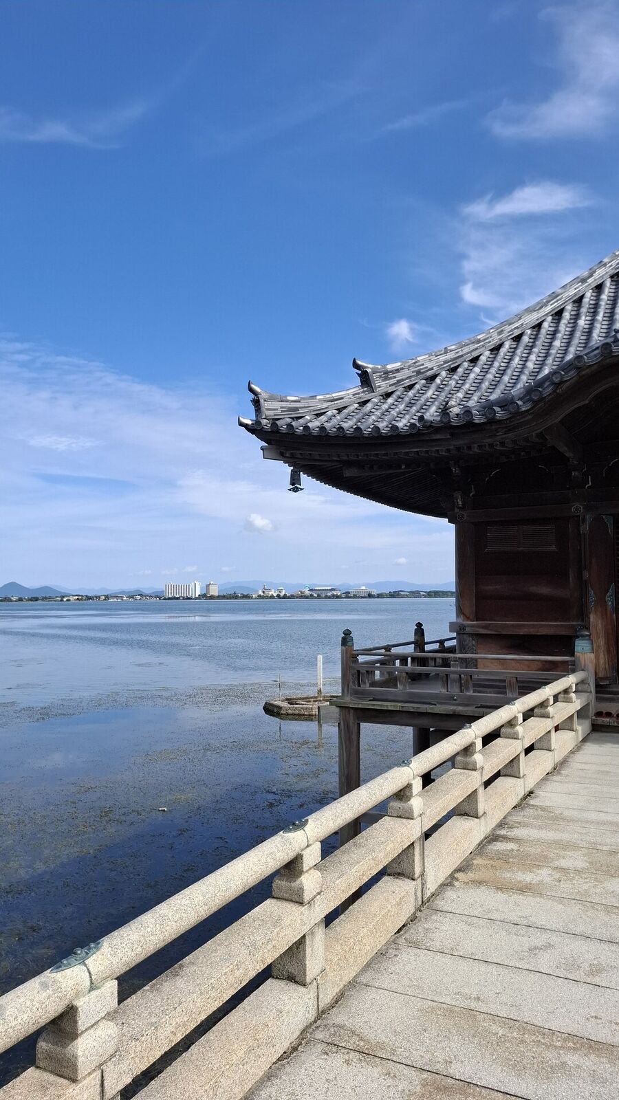 Close view of the Ukimido pavilion from the bridge, showing the curved temple roof and wooden structure