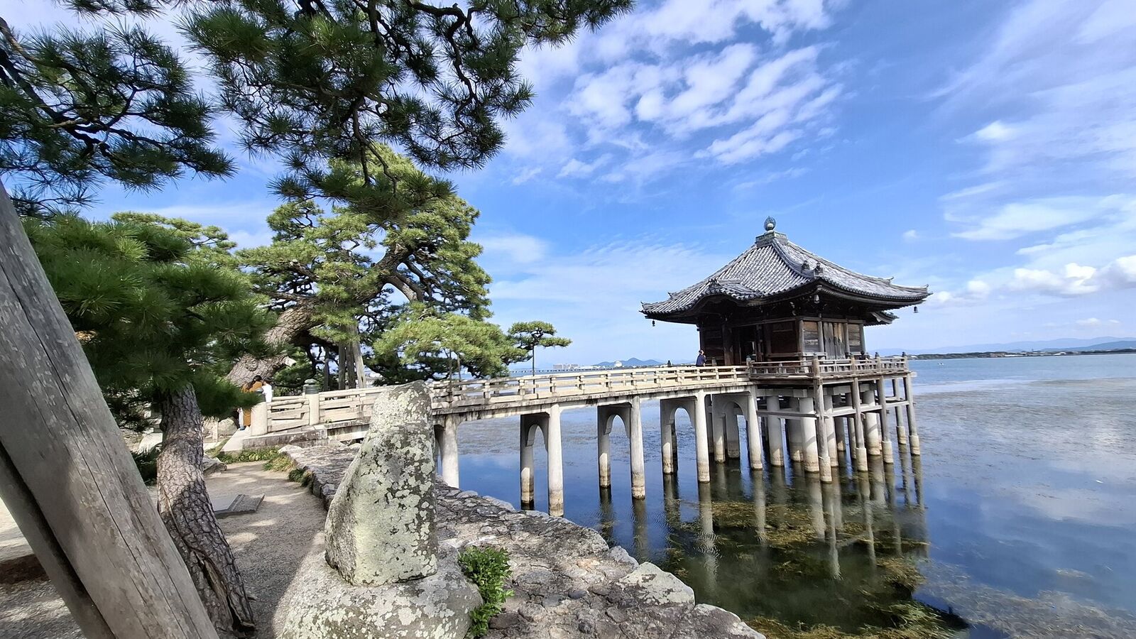 Final wide view of the Ukimido from the temple grounds, the pavilion floating above its reflection in the still water