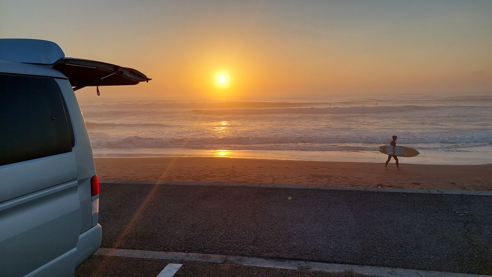 Campervan and surfer at sunrise, Kujukuri Beach