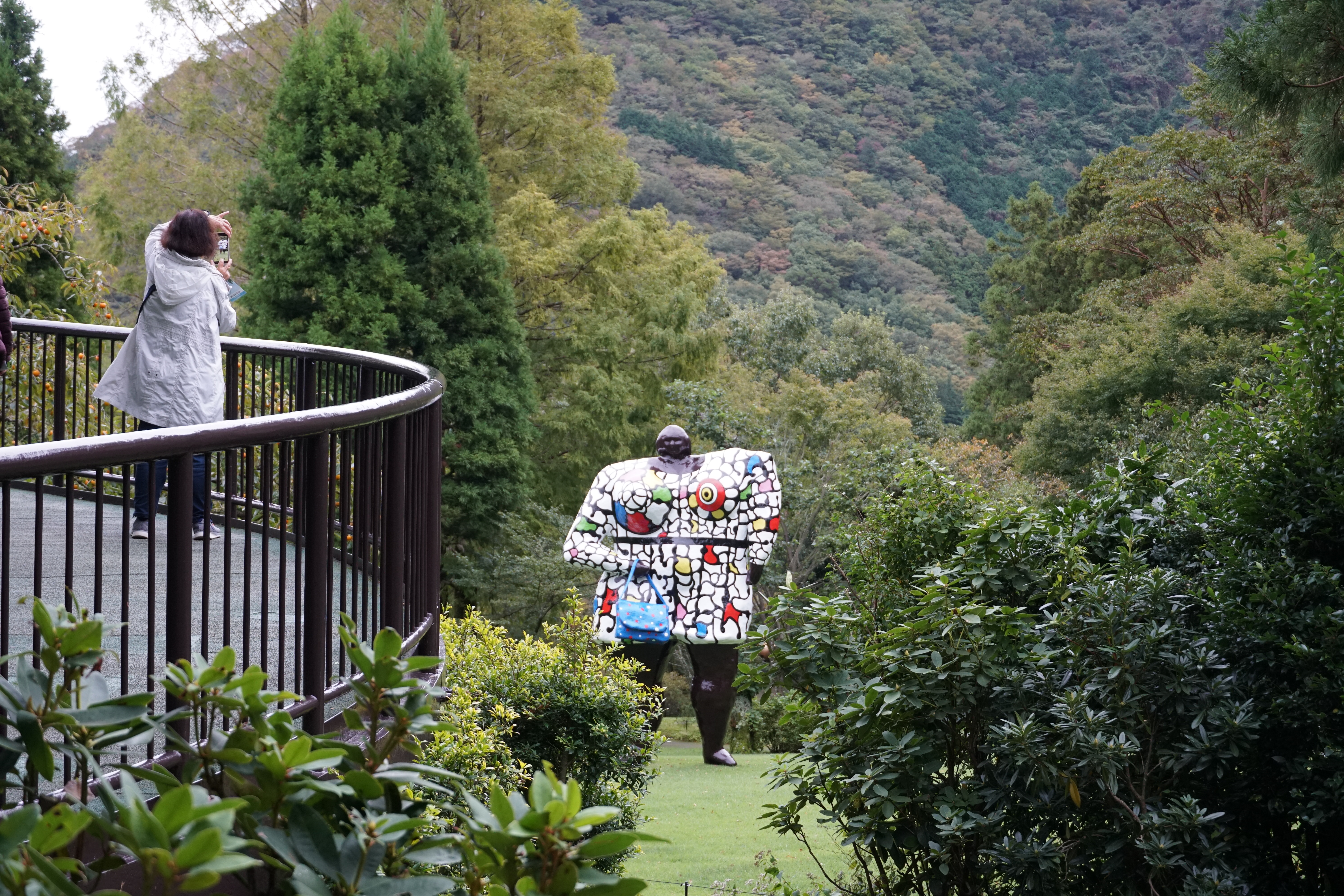 Figure sculpture with mountains visible behind