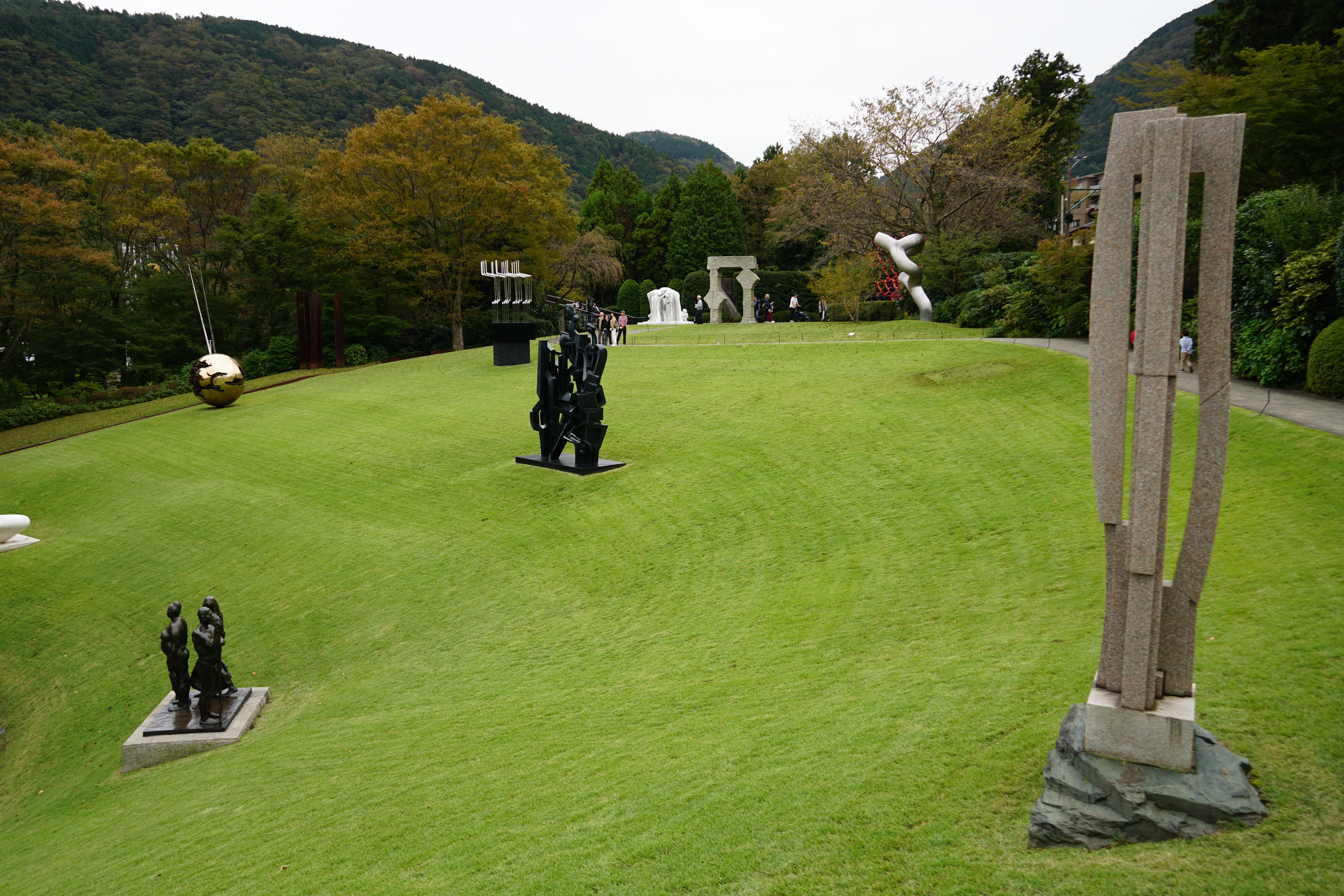 Overview of sculpture park with pieces scattered across lawns