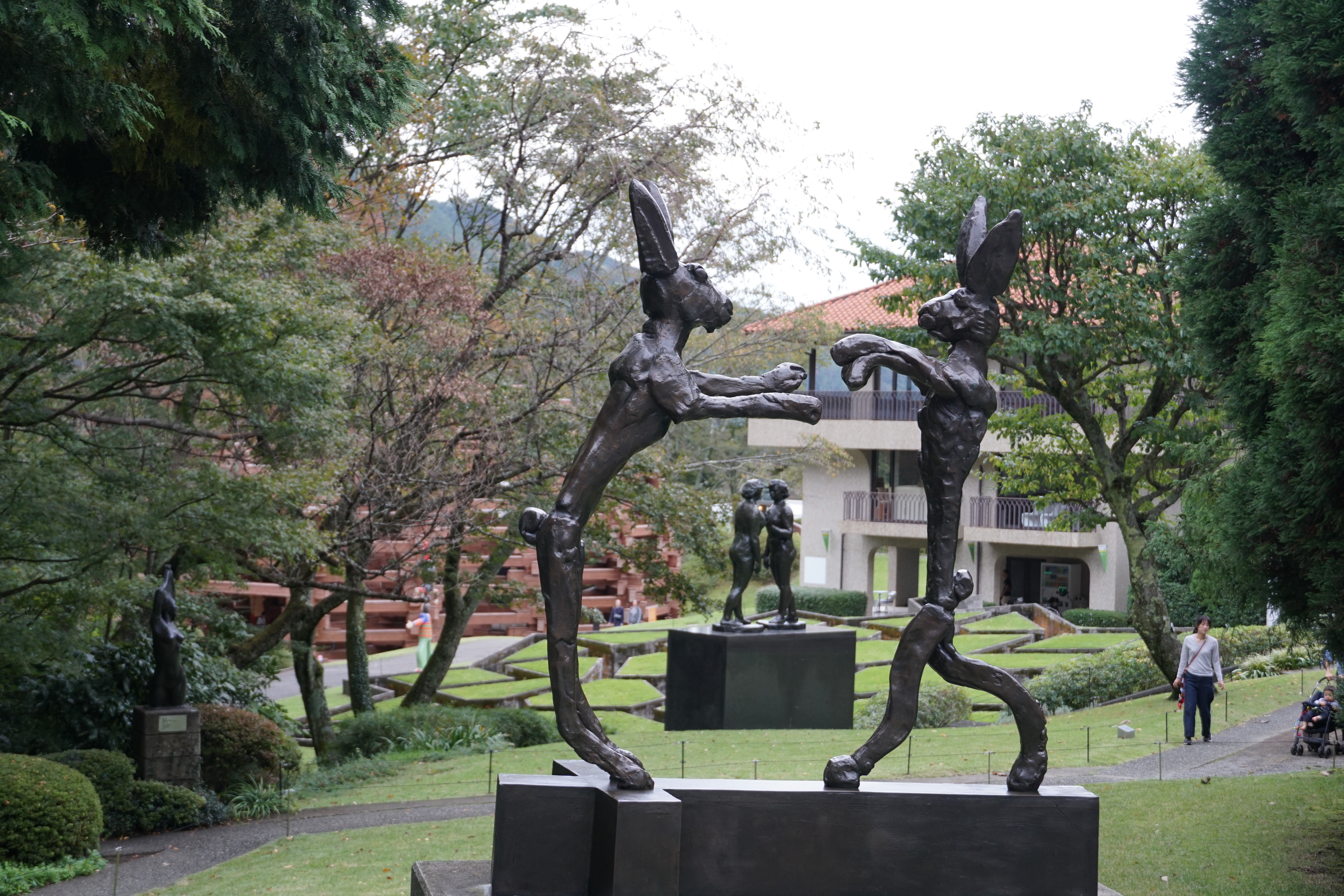 Tall bronze standing figure on the museum grounds