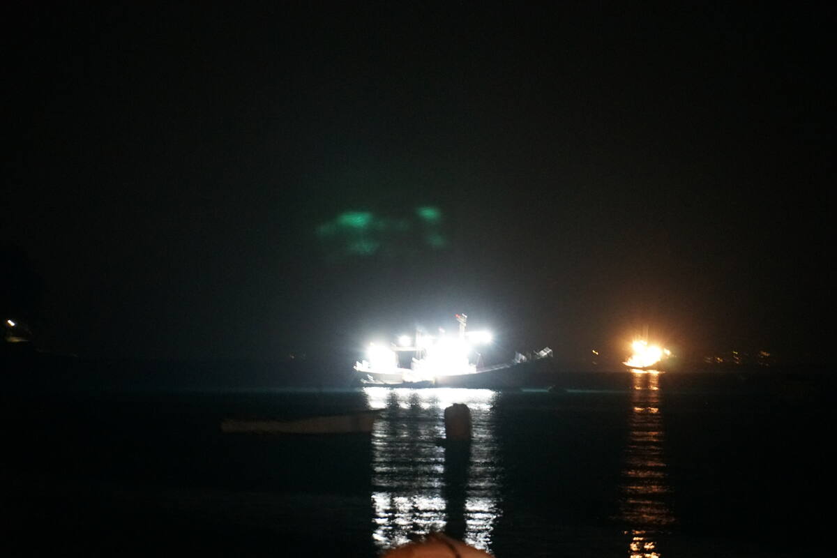 Heda harbour at dawn in October with calm waters and fishing boats beginning their day