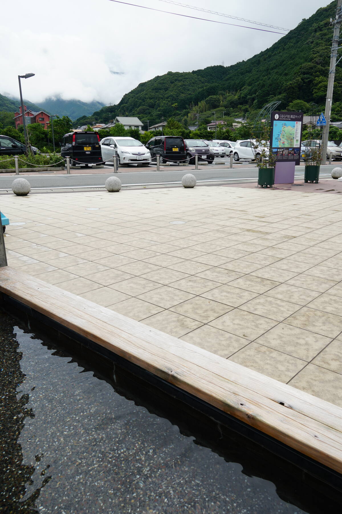 Heda harbour at dawn with fishing boats and Mount Fuji visible across Suruga Bay in the distance