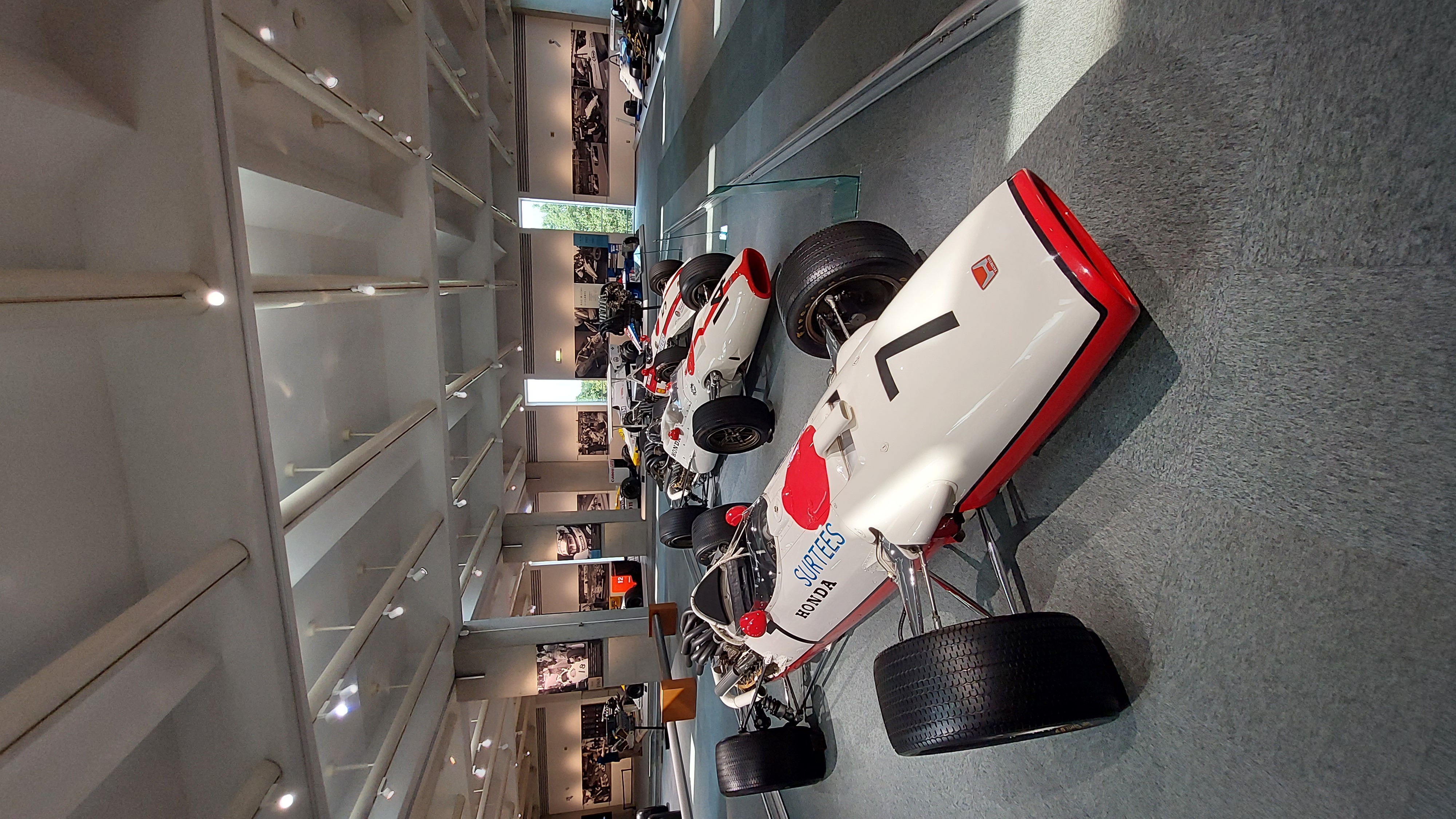 Honda Formula 1 cars including the McLaren-Honda from the Senna era, lined up on the racing floor