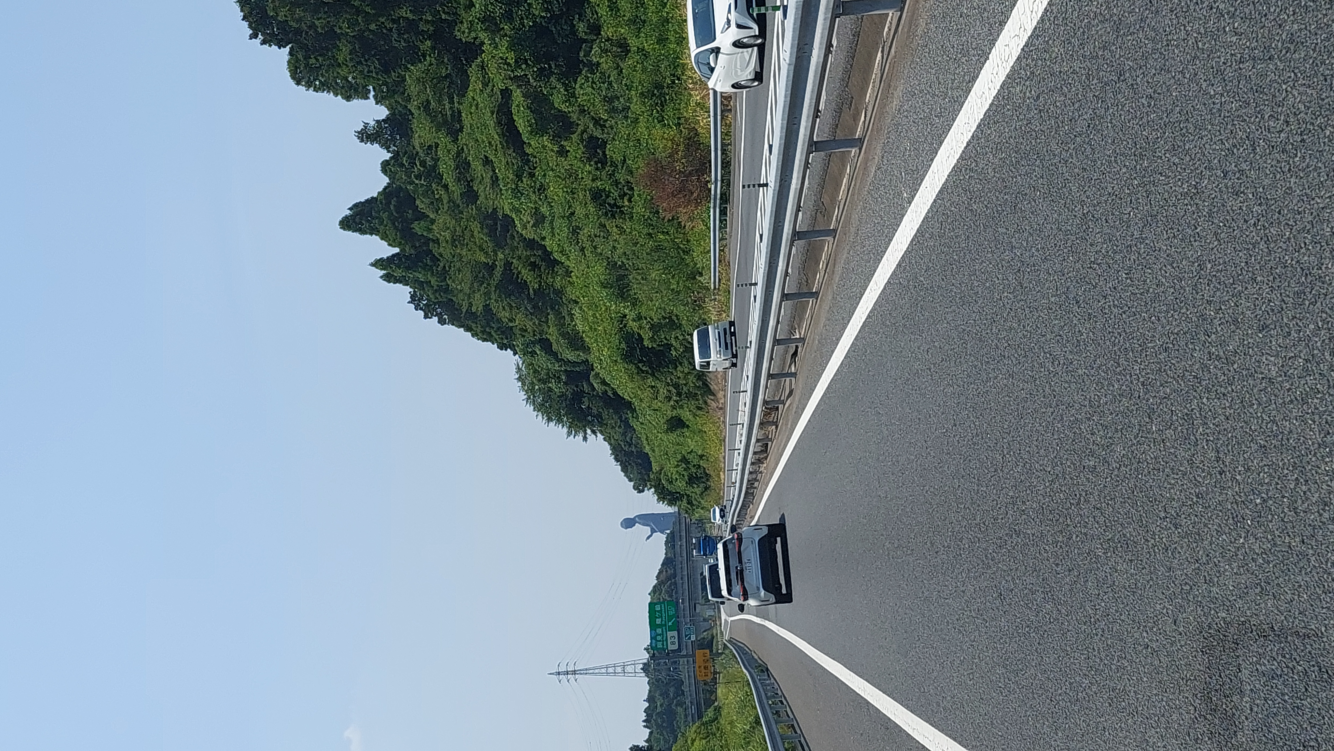 The mountain road to Mobility Resort Motegi through Tochigi forest, campervan on the highway