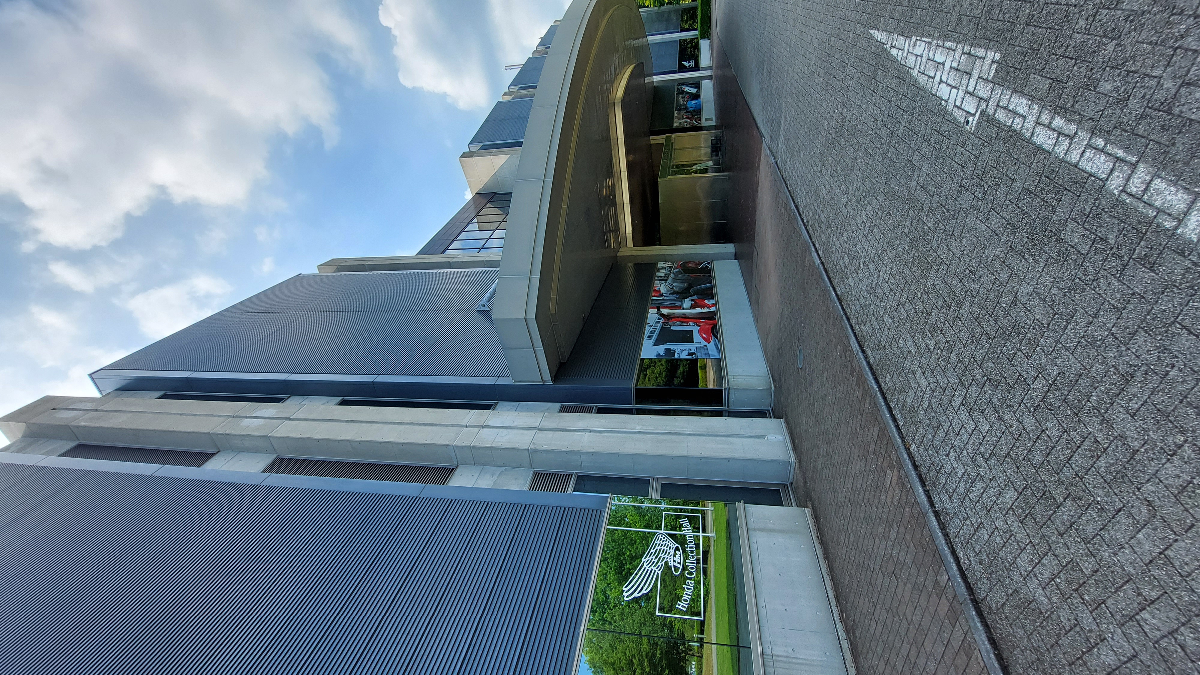 Honda Collection Hall entrance with wing logo and modern concrete facade