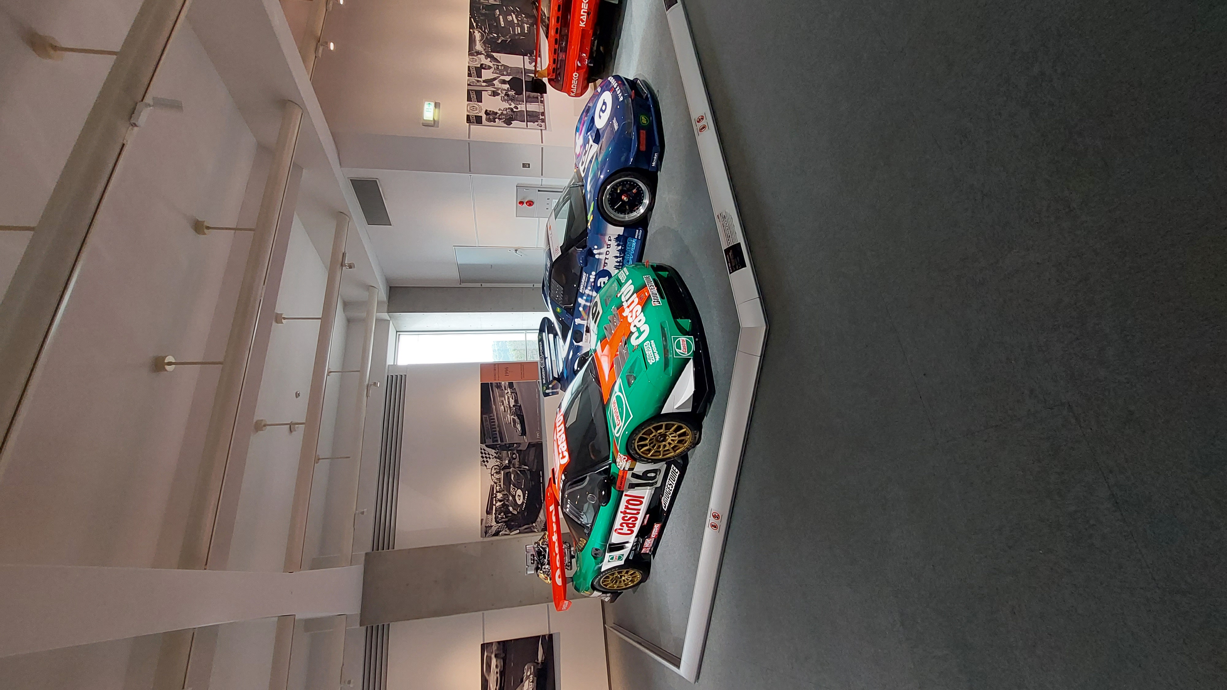 Super GT Honda NSX cars lined up, multiple liveries from different seasons