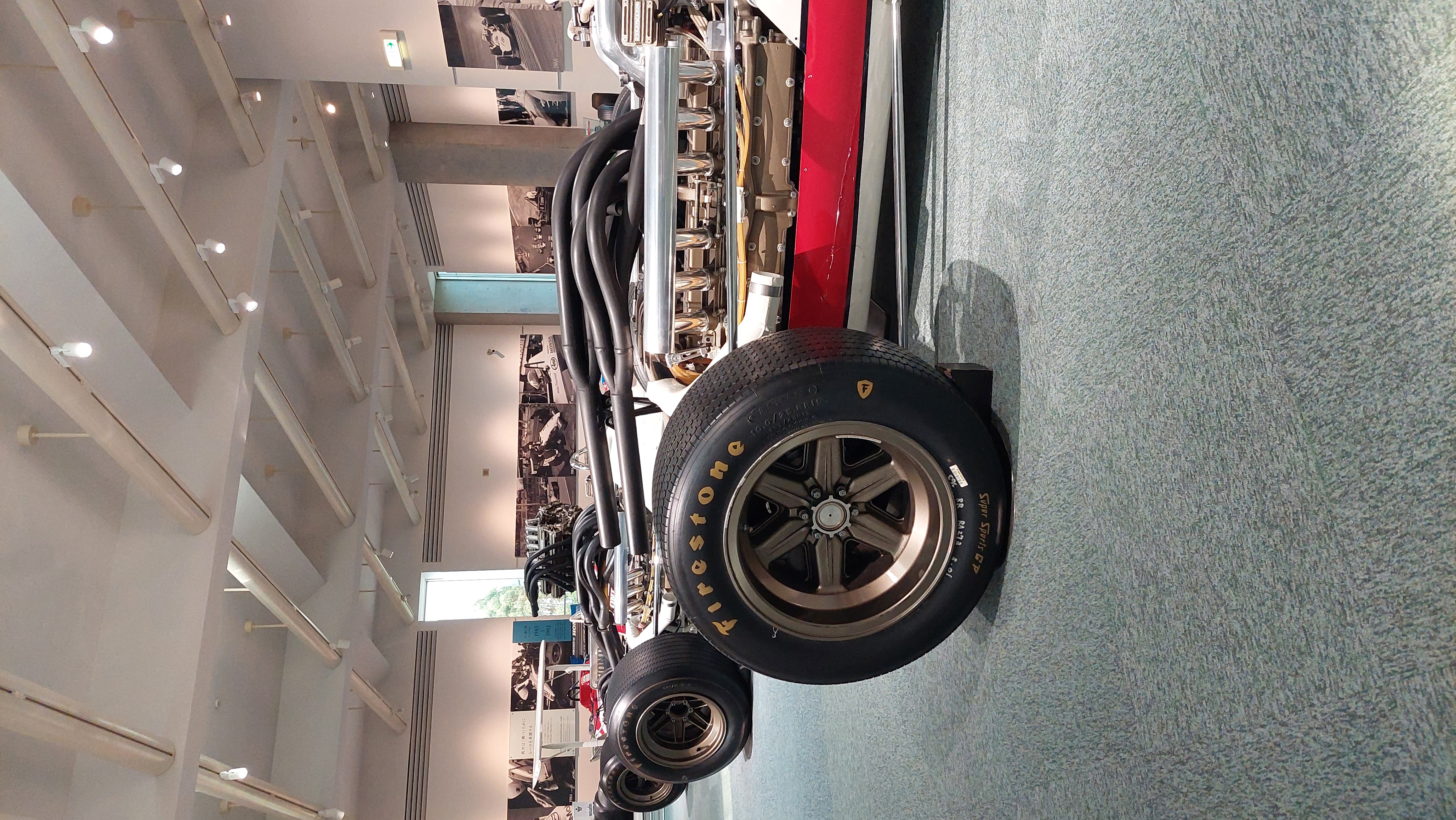 Vintage Honda F1 car rear detail, Firestone tires and exposed mechanical components