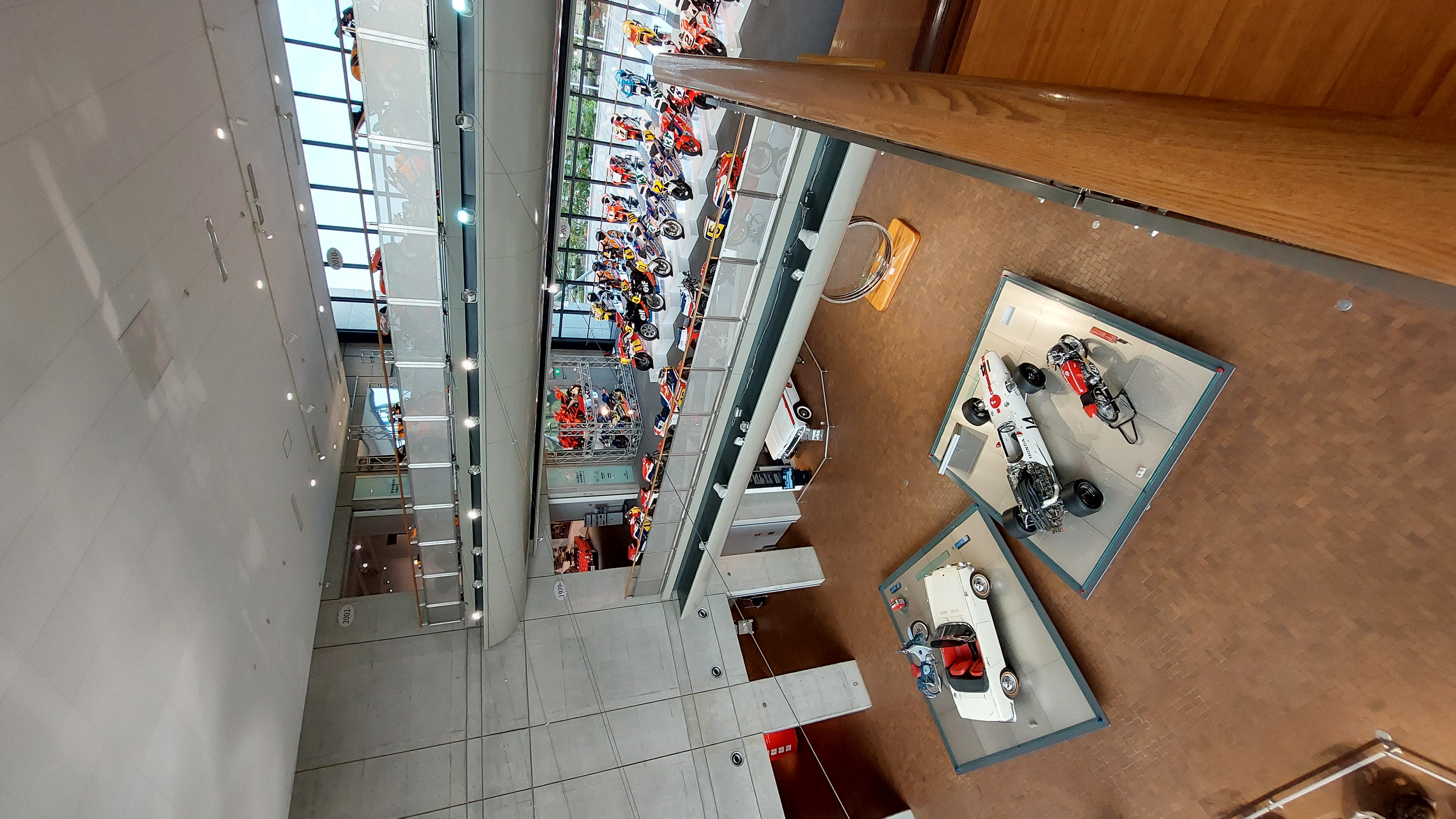 View from above into the museum atrium, the scale of the collection visible from the upper walkway