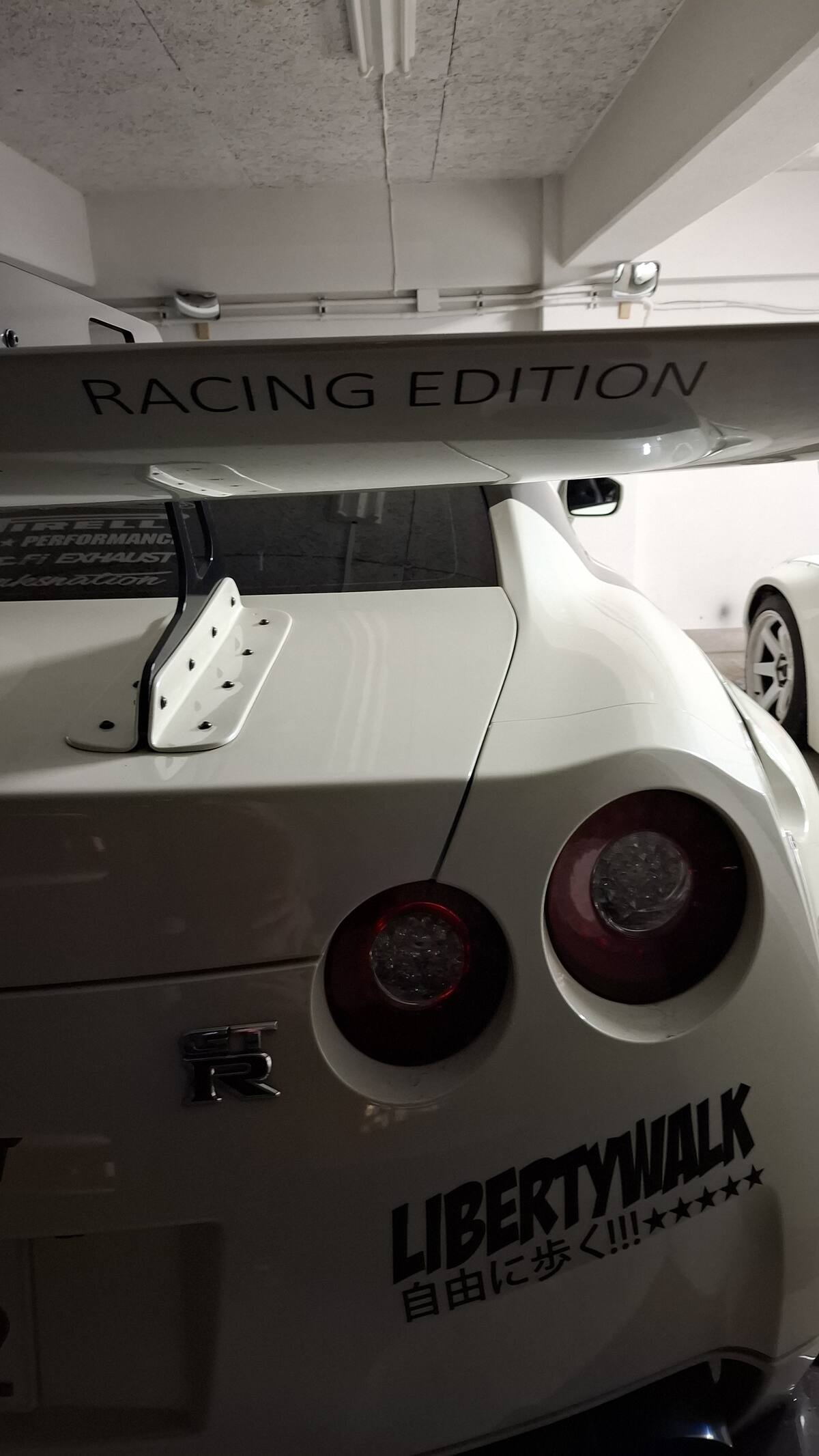 Racing Edition badge and rear wing detail on the white GT-R