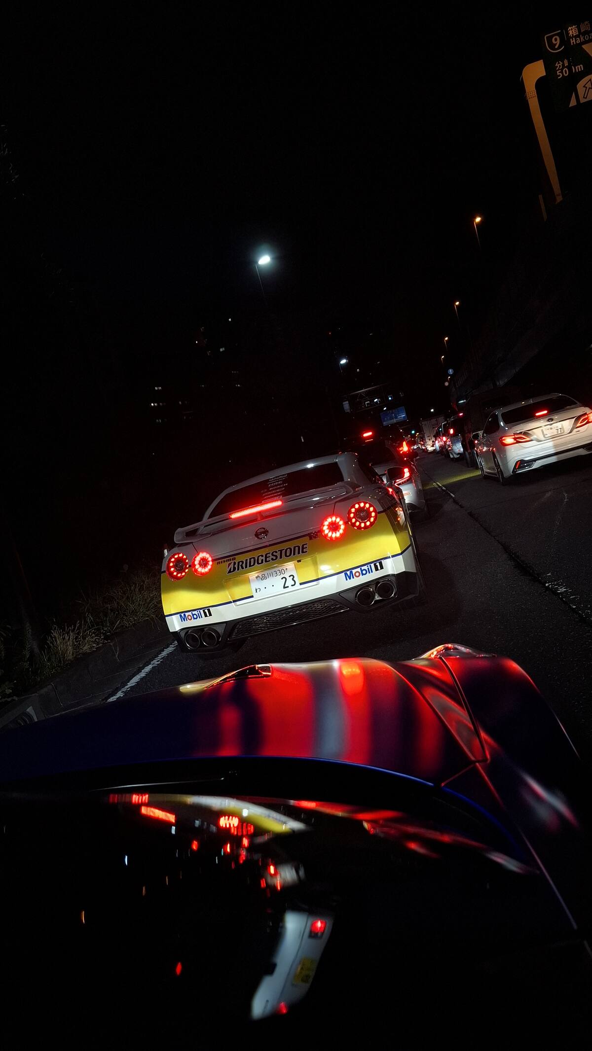 Following the Bridgestone #23 GT-R through the dark highway