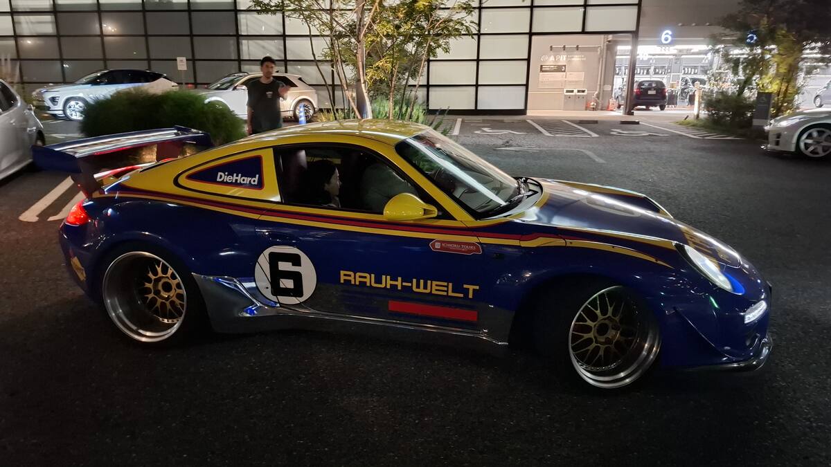 RWB Rauh-Welt Begriff Porsche in blue and gold livery at a stop
