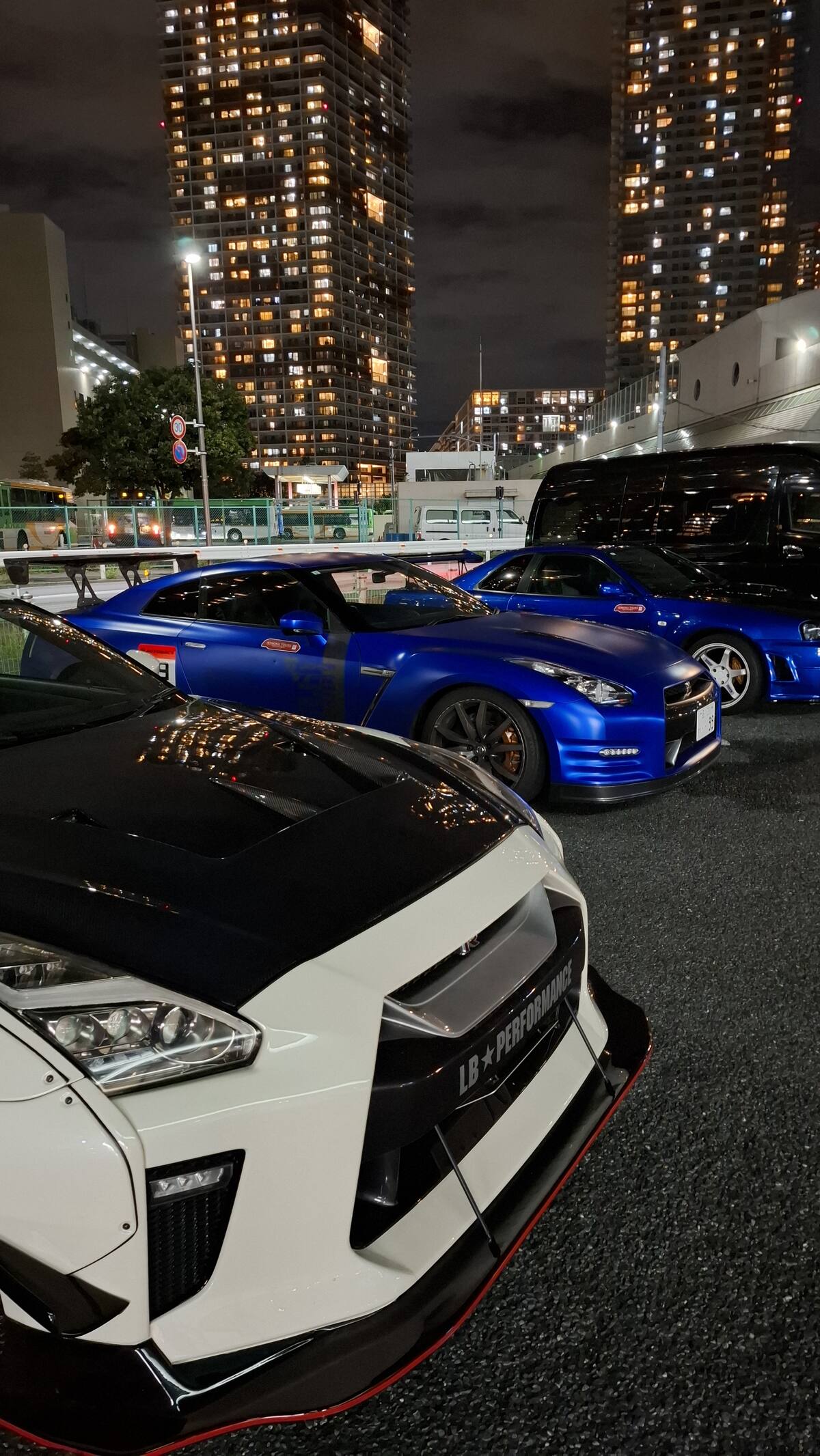 LBWK Lamborghini and blue GT-R parked together at night