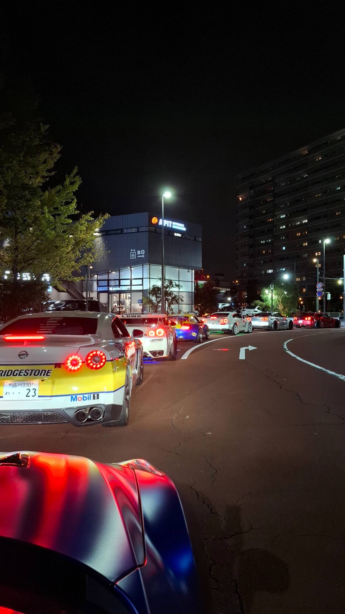 Convoy leaving with #23 Bridgestone GT-R leading