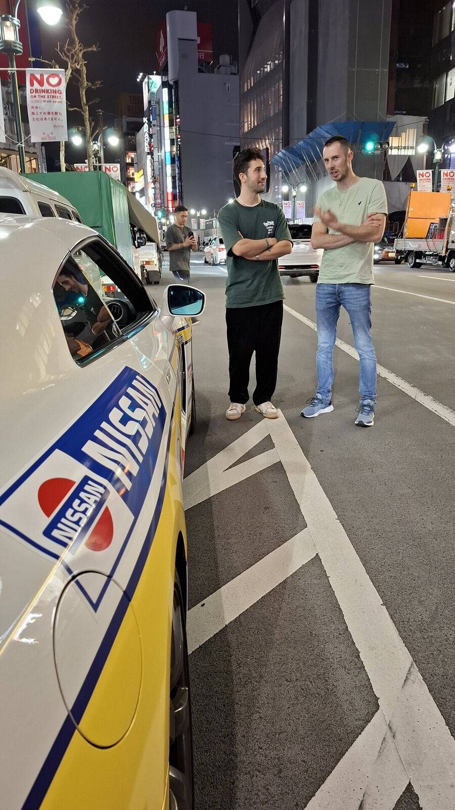 Standing next to the yellow Nissan-livery GT-R at Daikoku PA, the car culture community sharing the night