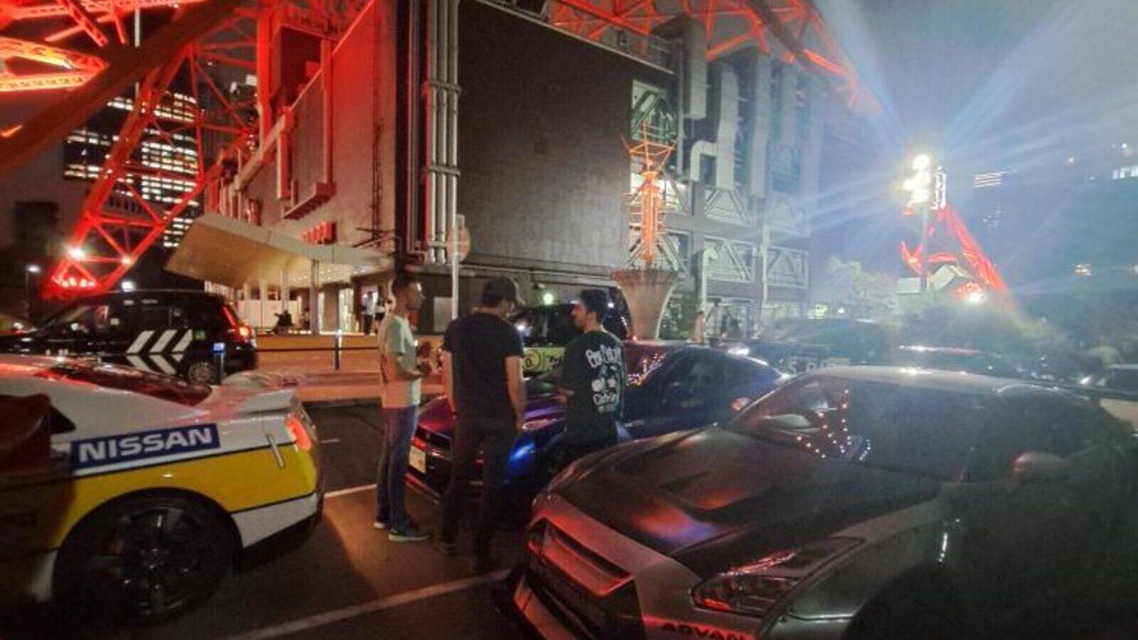 GT-R convoy parked beneath Tokyo Tower at night