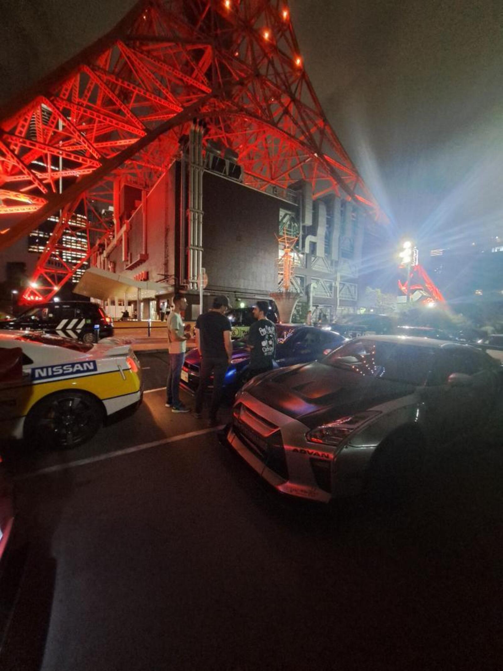 GT-R convoy parked beneath Tokyo Tower at night