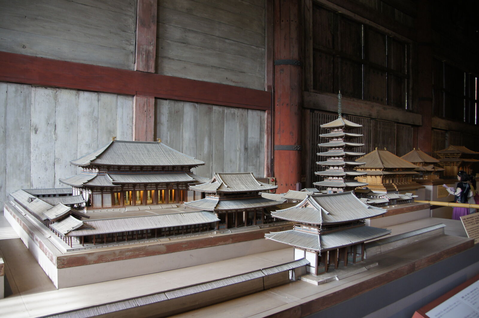 A detailed miniature model of the original Todai-ji complex displayed inside the hall, showing the temple compound at its greatest extent with multiple halls and a towering pagoda