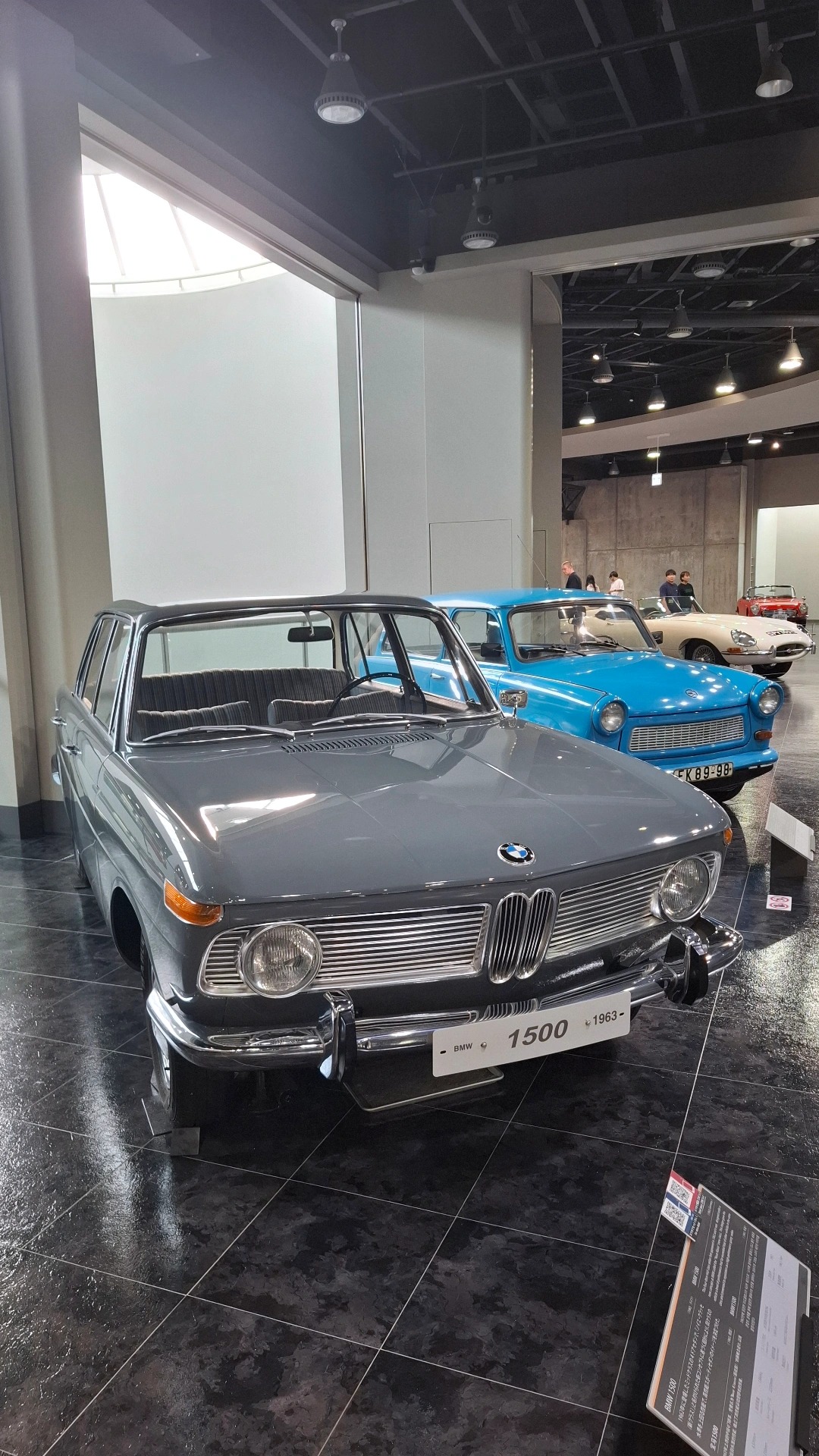 1962 BMW 1500 Neue Klasse in gray, the car that saved BMW from bankruptcy, Trabant visible behind in blue
