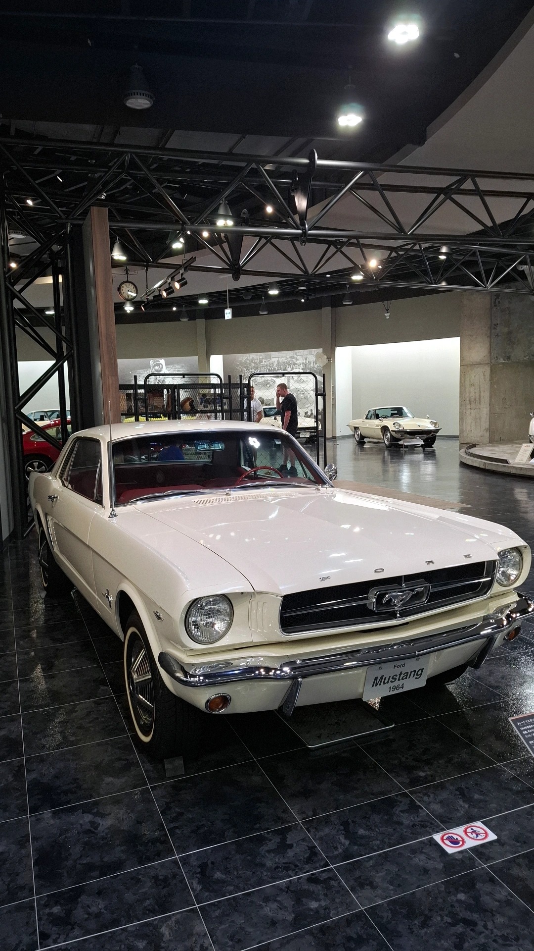 1964 Ford Mustang in white with red interior, the car that invented the pony car segment