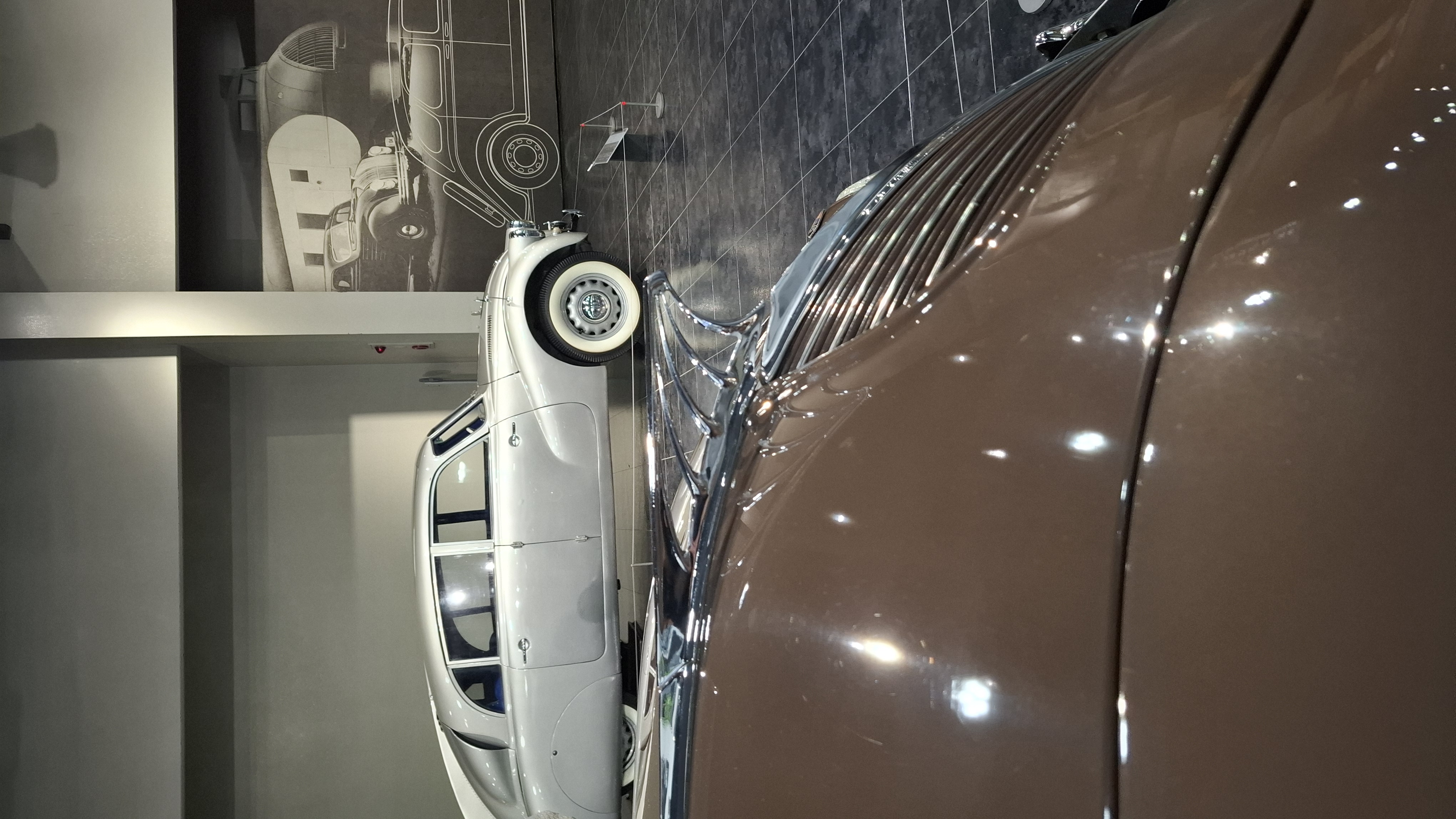 DeSoto chrome and curves, streamlined 1930s bodywork gleaming under museum lights