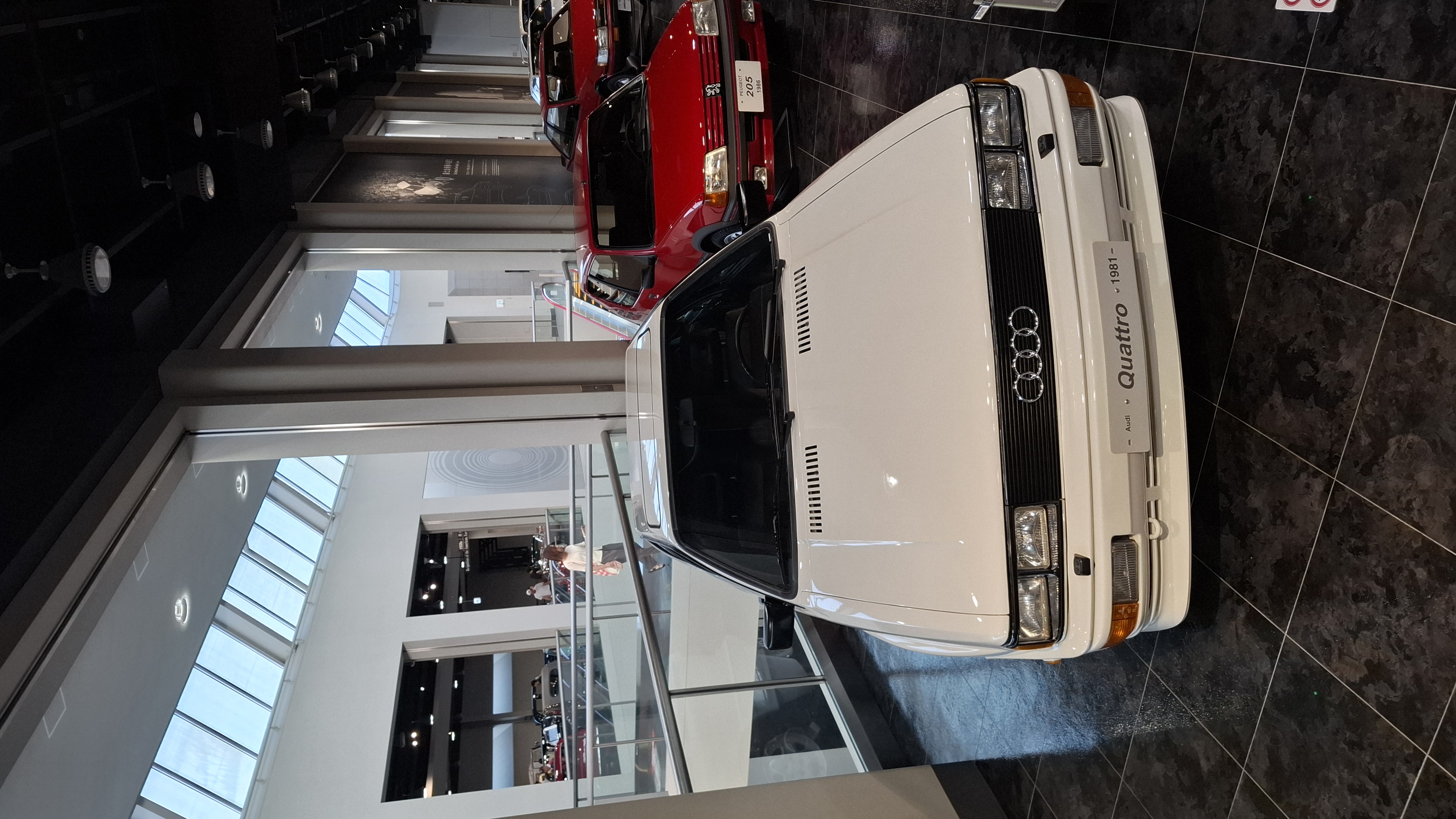 White Audi Quattro, the car that changed rallying forever, with the red NSX visible behind it