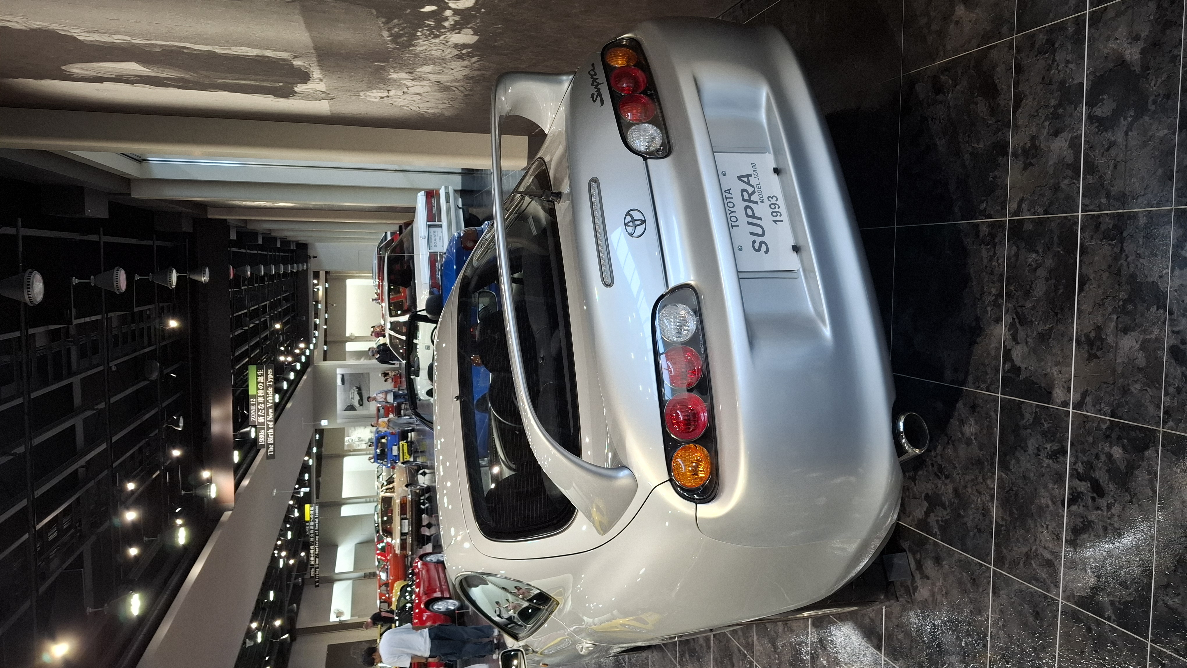 Silver Toyota Supra A80 rear view, the whale tail spoiler and round taillights, the car Fast and Furious made legendary