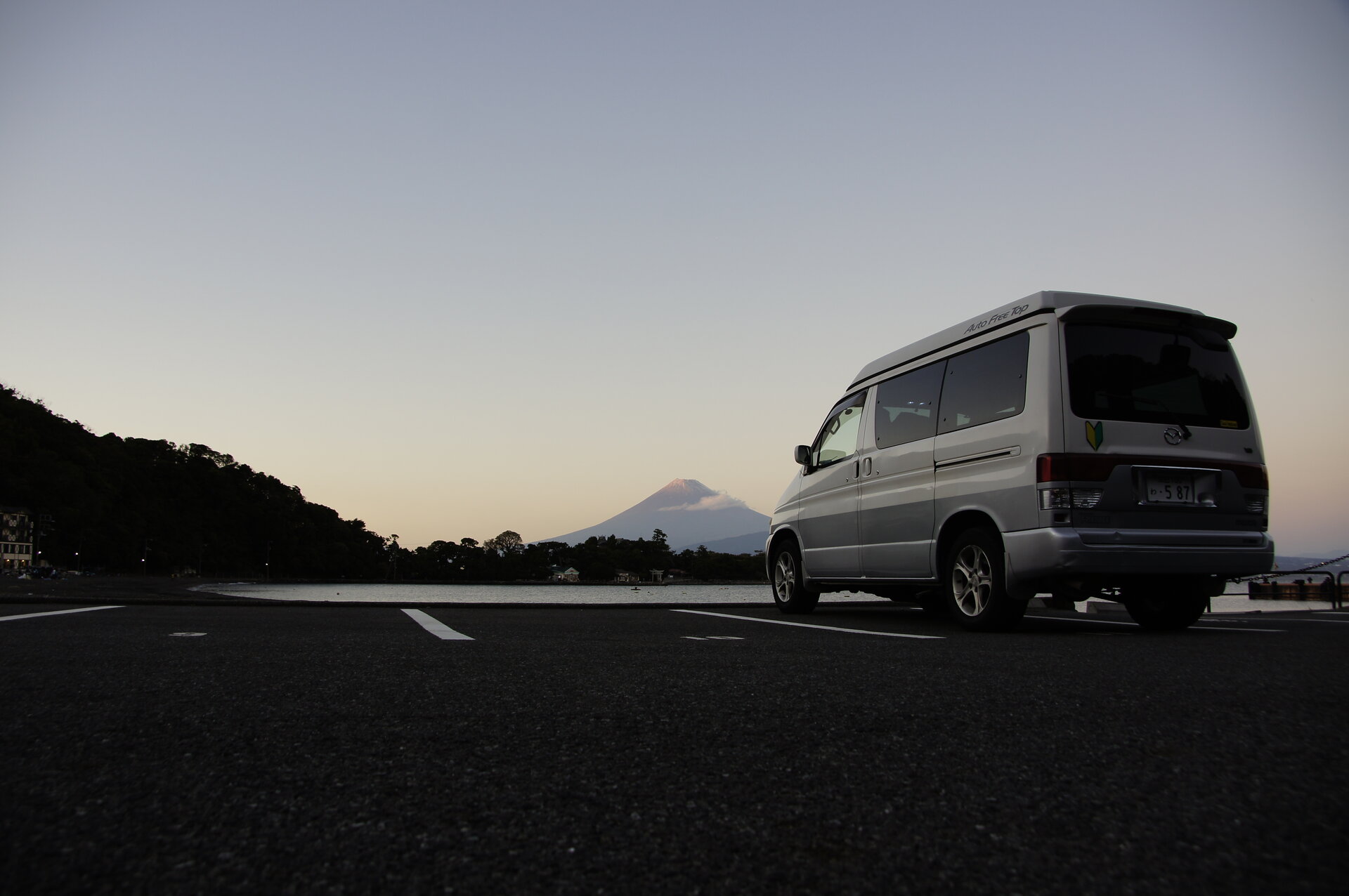 Campervan at Cape Ose with Mount Fuji at sunset