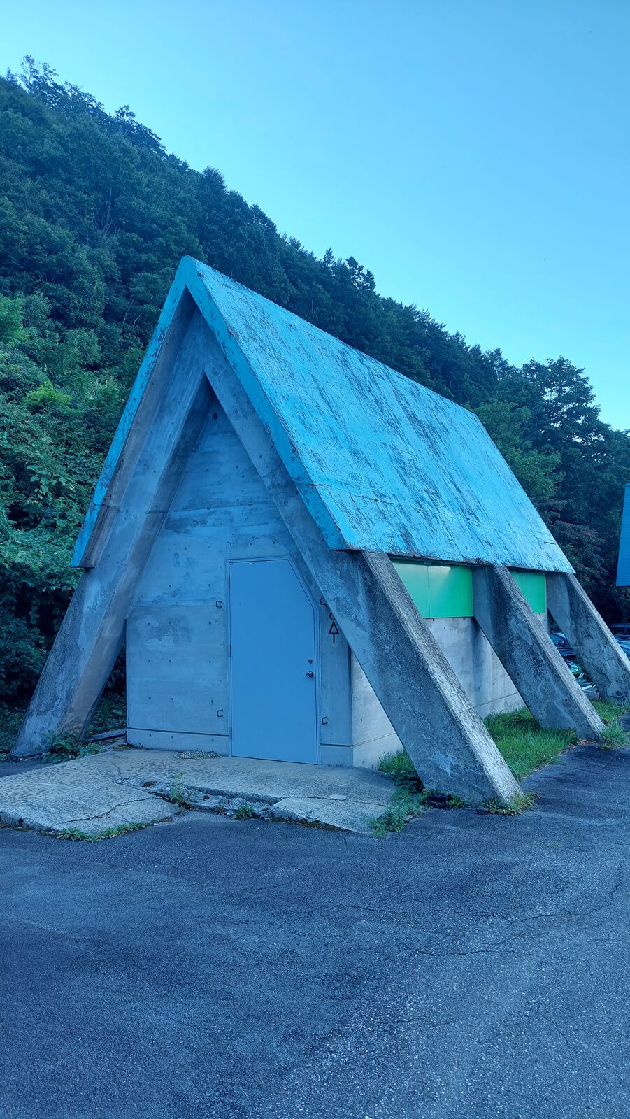 Concrete volcanic debris shelter built into the roadside, protection against eruptions from Mount Hakusan